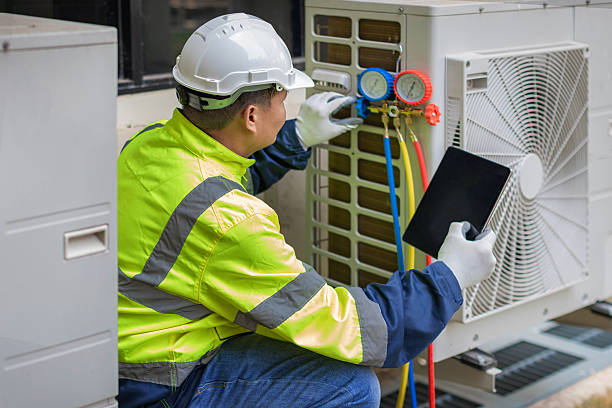 Professional Air Conditioning Repair technician working in Howes Cave, NY
